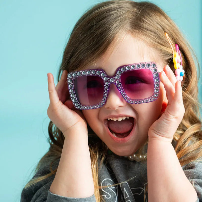 Plastic fashion sunglasses showing available colour options like black frame grey lens and pink frame pink lens.