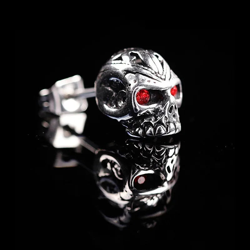 Retro skull stud earrings with red eye detailing and artificial gemstone inlay on alloy base