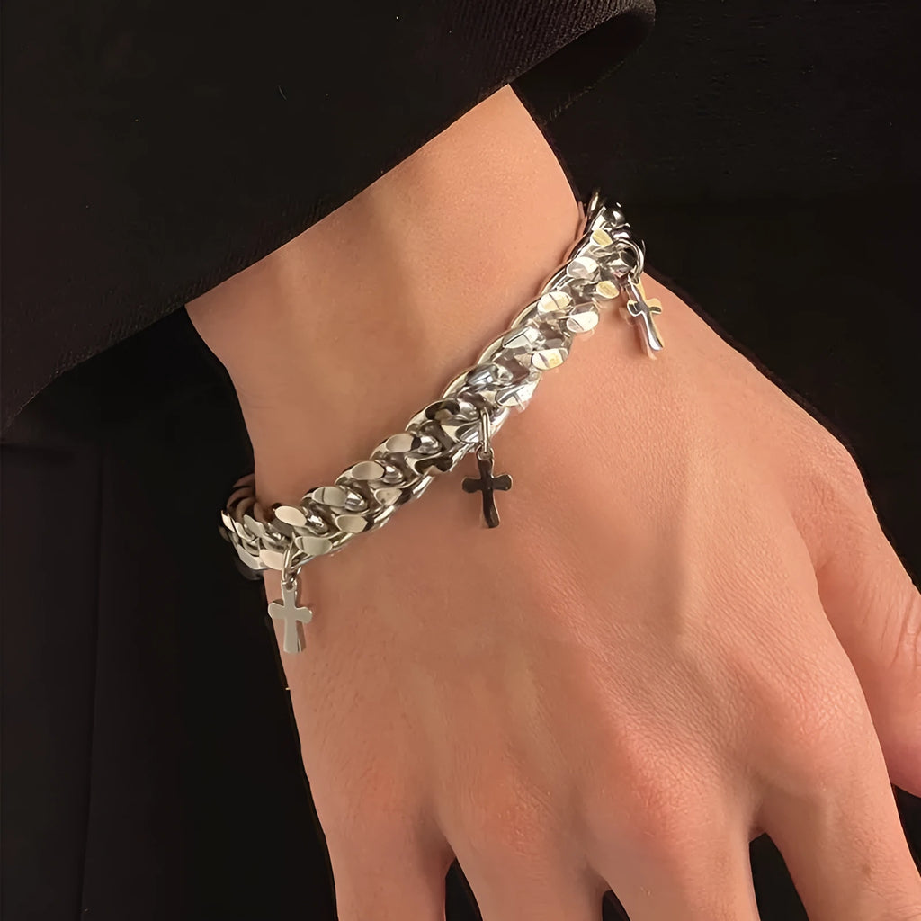 Men's titanium steel bracelet with a cross design and geometric shape on a wrist.