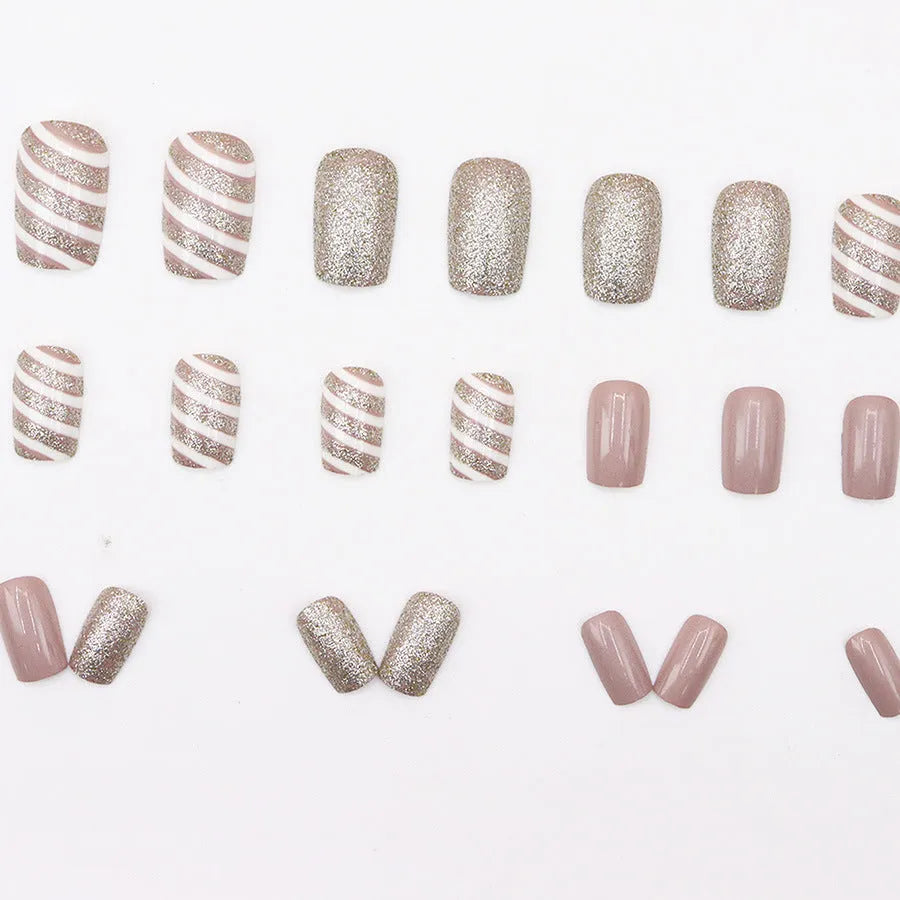 Champagne light white false nails with floral pattern, twill finish, mid-length wearable armour, and glue
