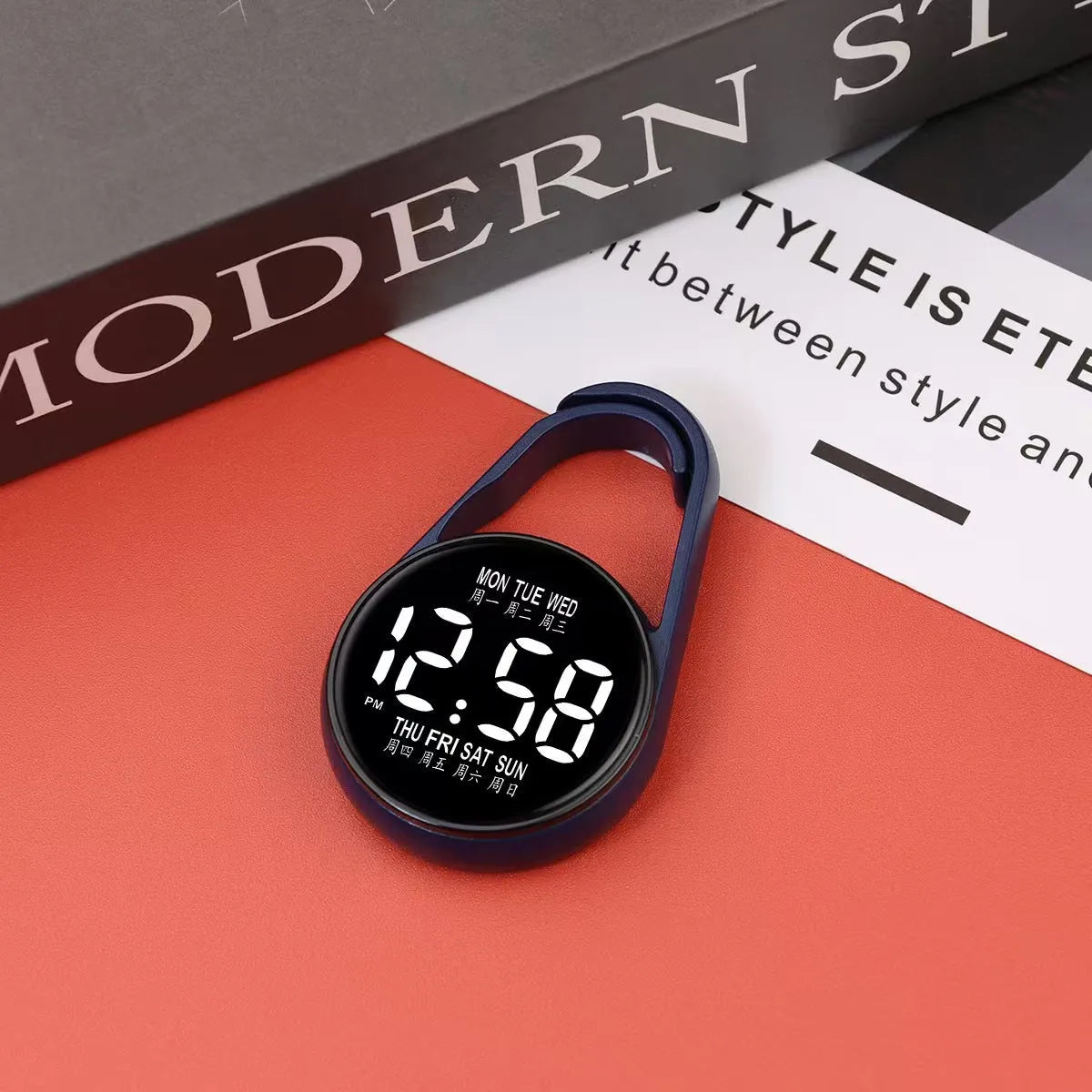 LED luminous electronic digital watch with plastic strap, shown in one of ten available colours on a wrist.