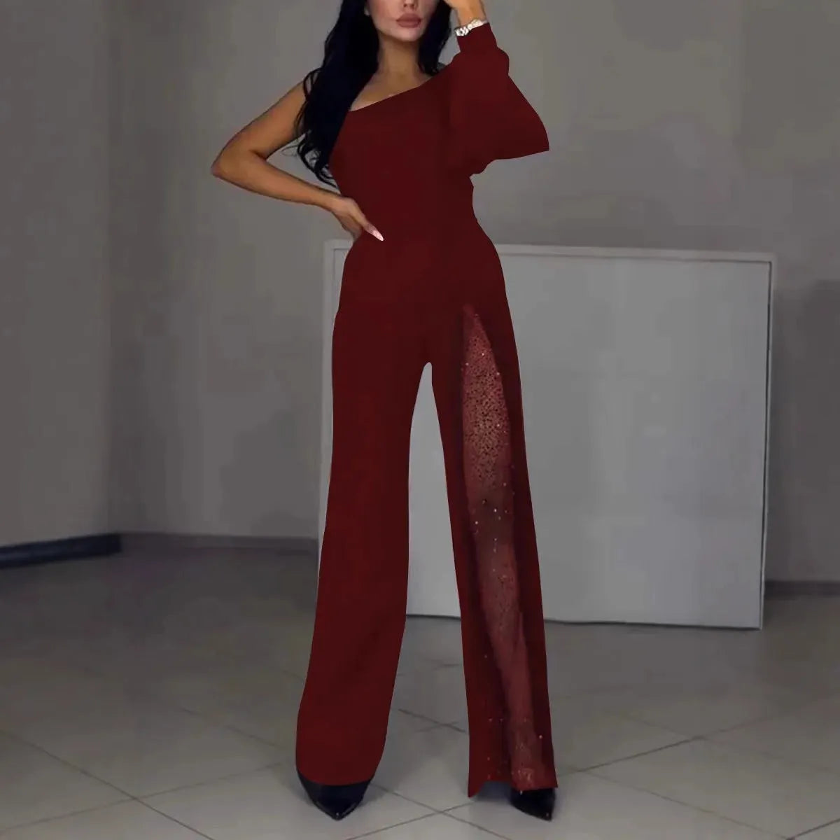 Women's long sleeve polyester jumpsuit with oblique shoulder and thigh-high slit in black, wine red, white, or dark blue.