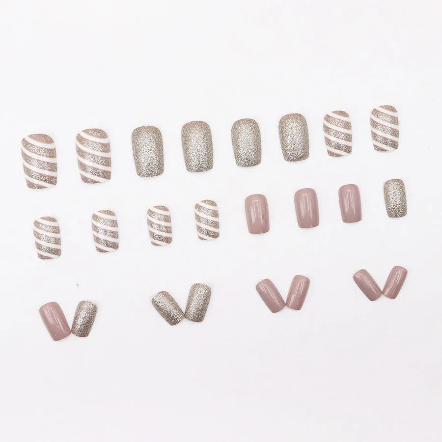 Champagne light white false nails with floral pattern, twill finish, mid-length wearable armour, and glue