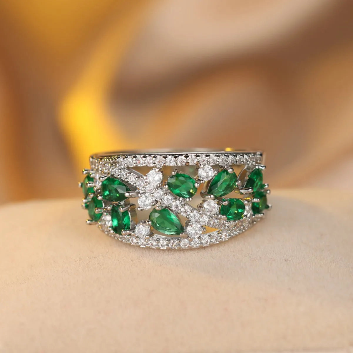 Women's round hollow fashion ring in copper with choice of gold or platinum finish and blue or white stone detail.
