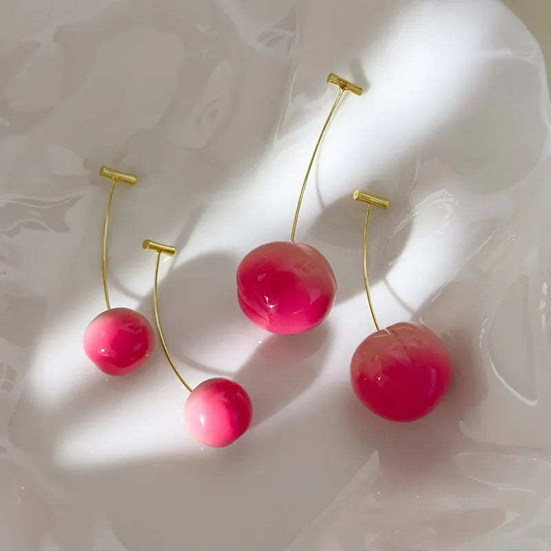 Women's acrylic peach fruit earrings in small and large size options with copper findings