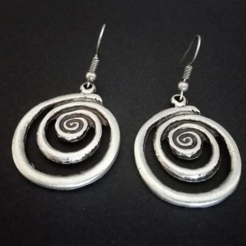 Geometric spiral distressed silver alloy earrings measuring 2.6 by 5 centimetres