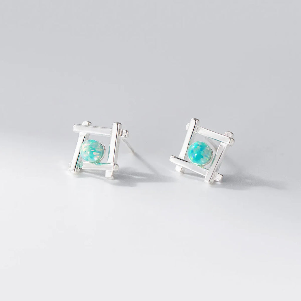 Geometric cross and quadrangle shape stud earrings for women in sterling silver.