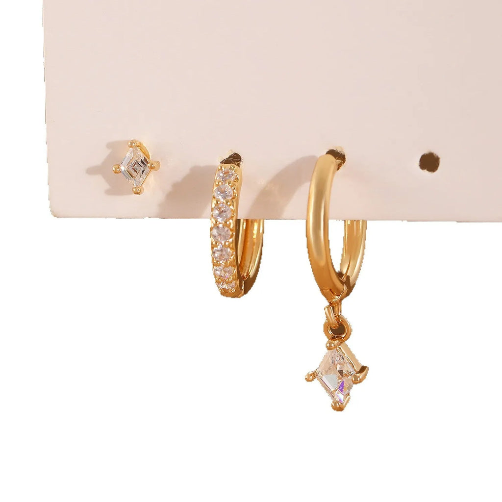 Geometric ladies earring set with zircon detailing in gold and silver options showing drop, stud, and clip-on pieces