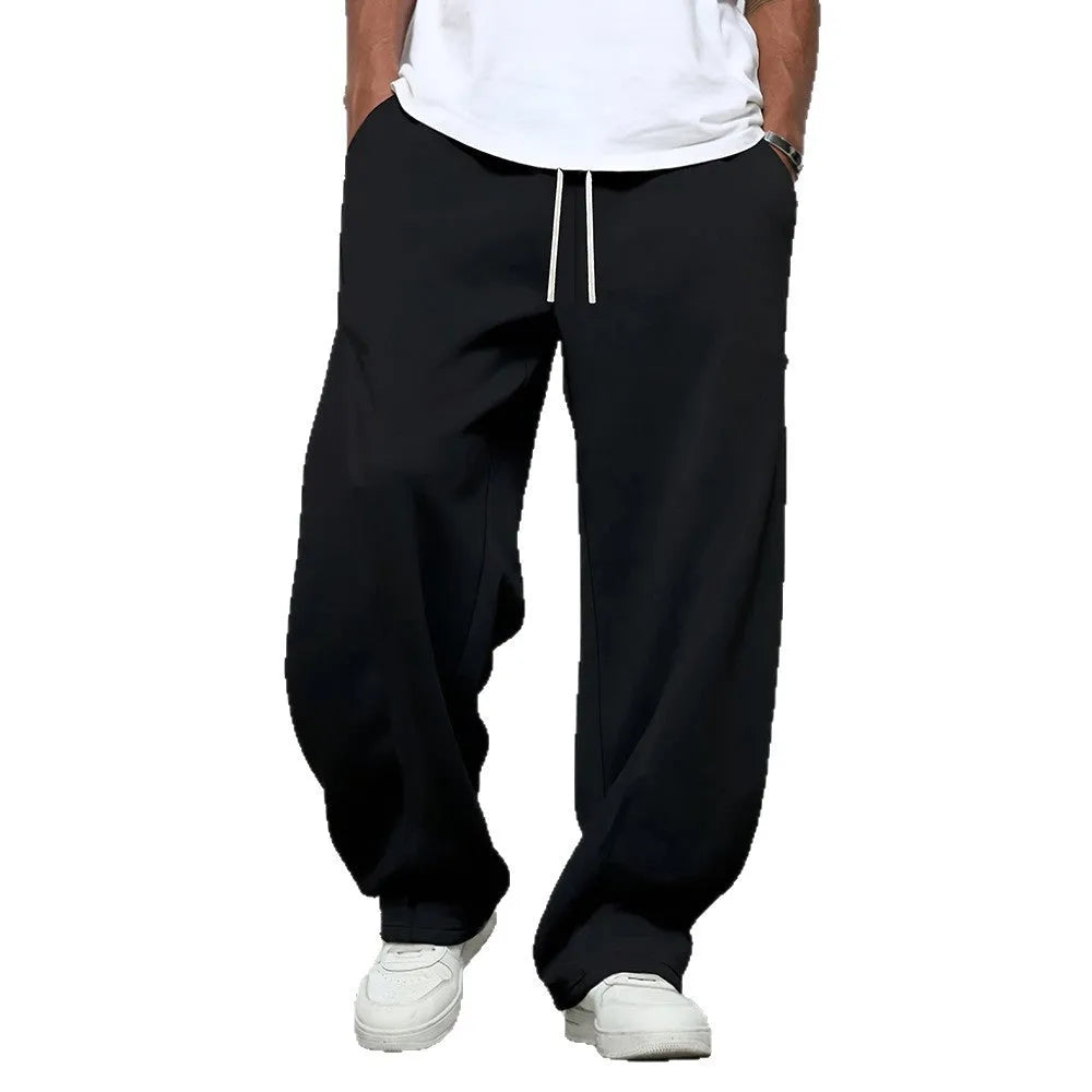 Men's straight-leg casual trousers in black polyester with a drawstring waistband.
