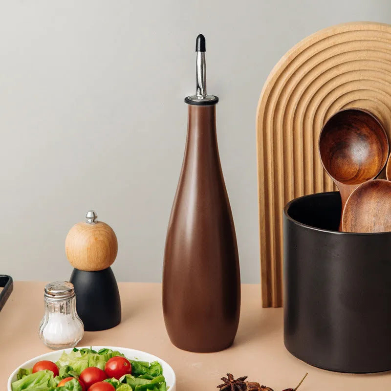 Ceramic oil pot with brush and funnel in black, coffee, or white colour, 650ml capacity.