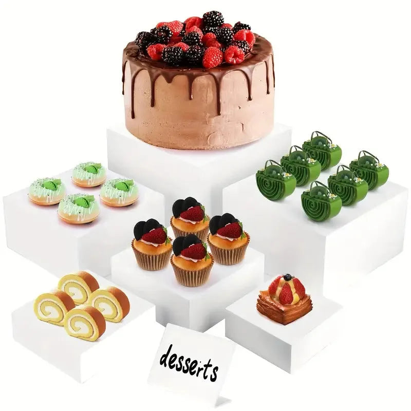 White plastic 6-piece interlocking cube dessert display stand showing tiered arrangement.