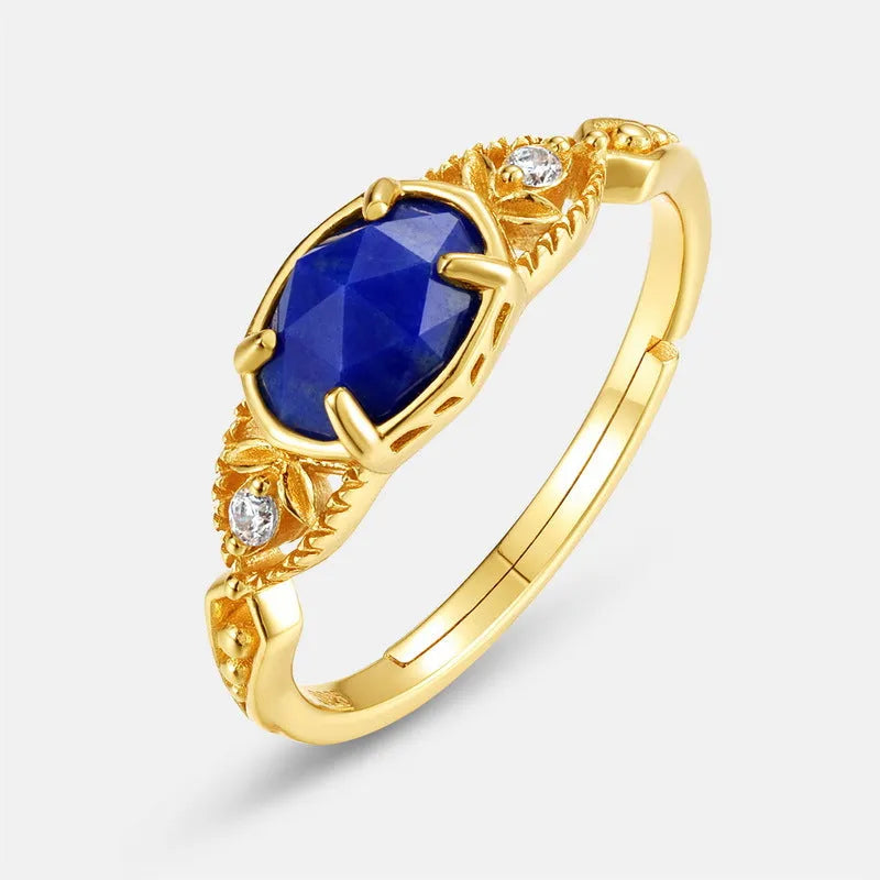 Oval geometric women's ring with a blue lapis lazuli stone in a silver alloy Japanese-style setting.