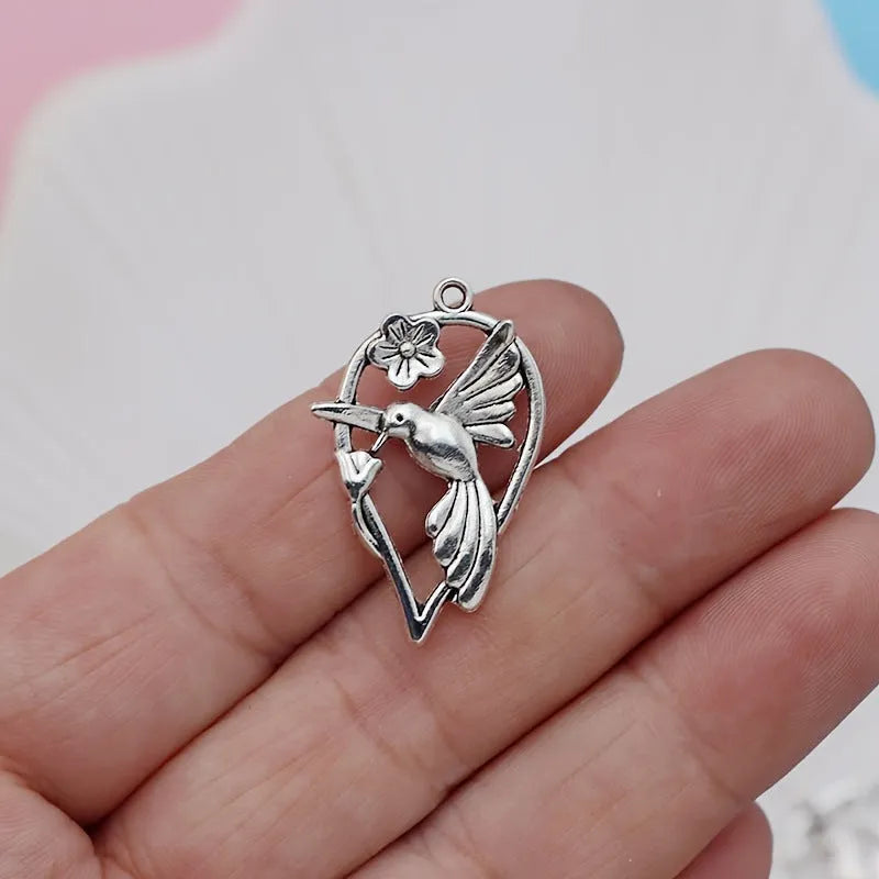 Silver-coloured magpie bird charm pendant for DIY jewellery making