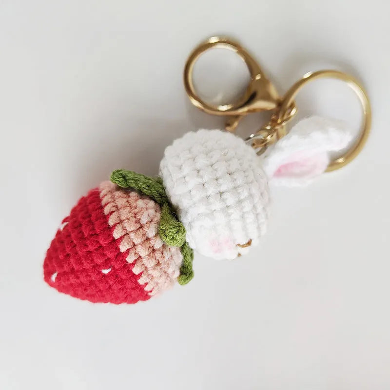 White hand-woven rabbit strawberry pendant on keychain made from doll wire