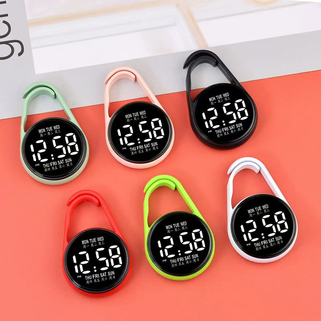 LED luminous electronic digital watch with plastic strap, shown in one of ten available colours on a wrist.