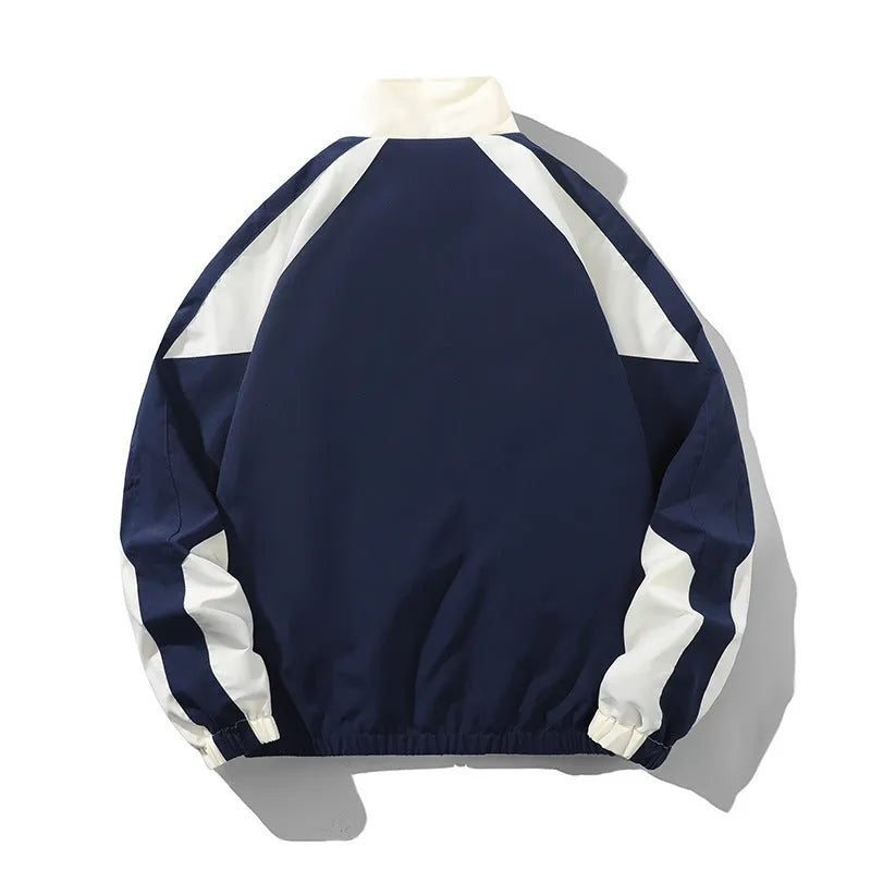 Men's black and dark blue colour block casual jacket with contrast stitching and side pockets.