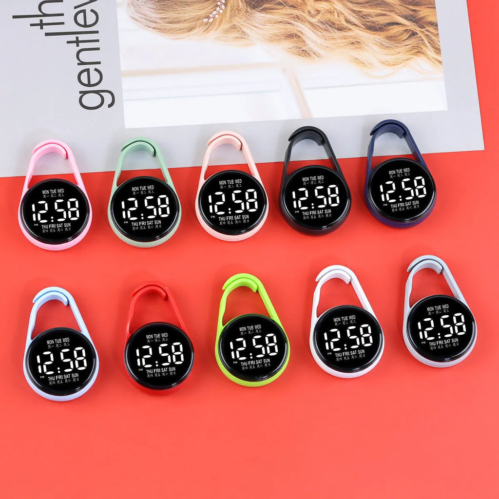 LED luminous electronic digital watch with plastic strap, shown in one of ten available colours on a wrist.