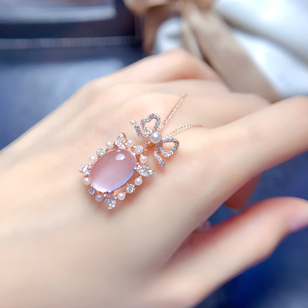 Geometric silver pendant with pink rose quartz crystal and rose gold plating on alloy chain
