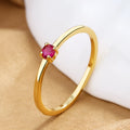 Copper geometric circle ring for women with a single diamond style in blue, green, red, or white on a size guide.