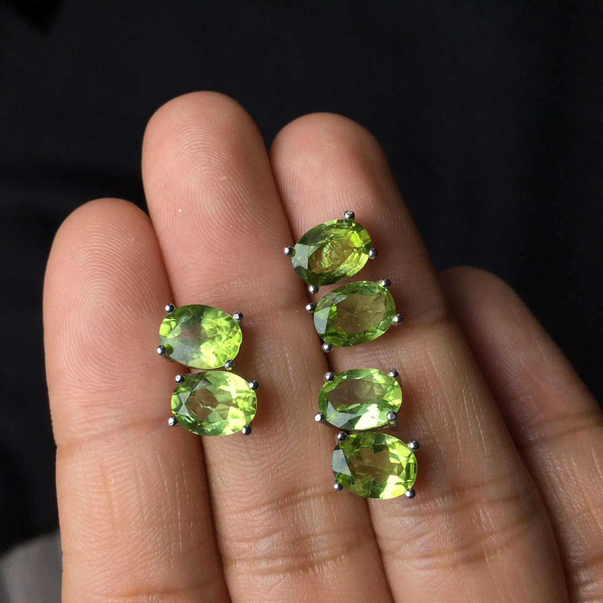 Pair of natural grass green olivine stud earrings with elliptical 6 × 8mm stones in S925 sterling silver settings