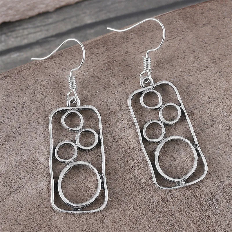 Geometric earrings with round ring and irregular square design in antique silver colour