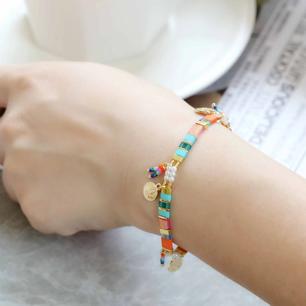 Women's glass coloured beaded bracelet with imitation pearl design showing six colour variations