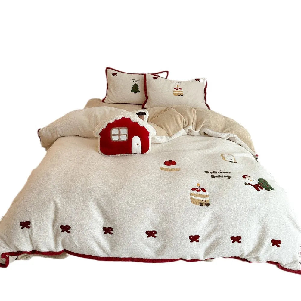 Winter Christmas cartoon patterned bedding four-piece set showing duvet cover, sheet, and pillowcases in pastel colours.
