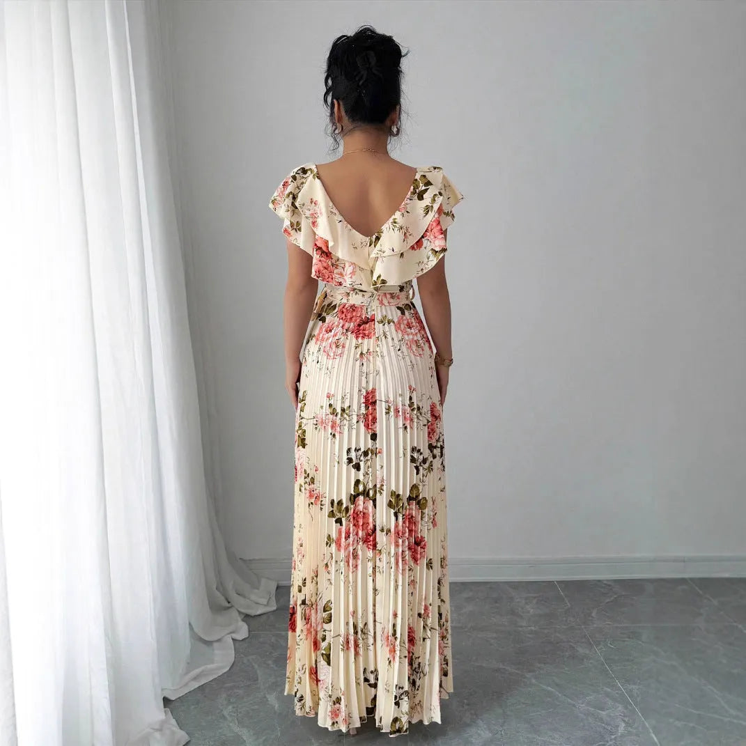 Apricot coloured floral print dress with V-neck, ruffled short sleeves, and a high-waisted oversized swing skirt.