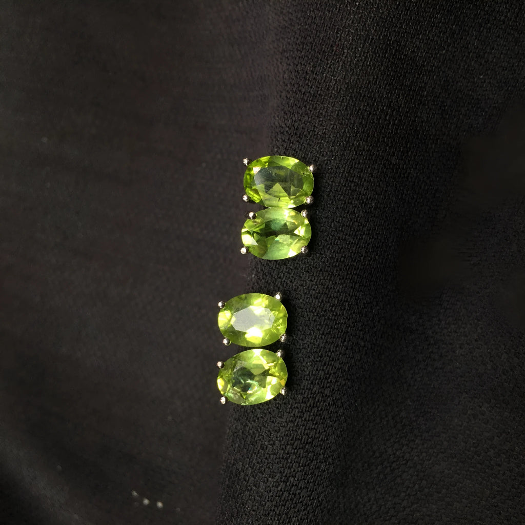 Pair of natural grass green olivine stud earrings with elliptical 6 × 8mm stones in S925 sterling silver settings
