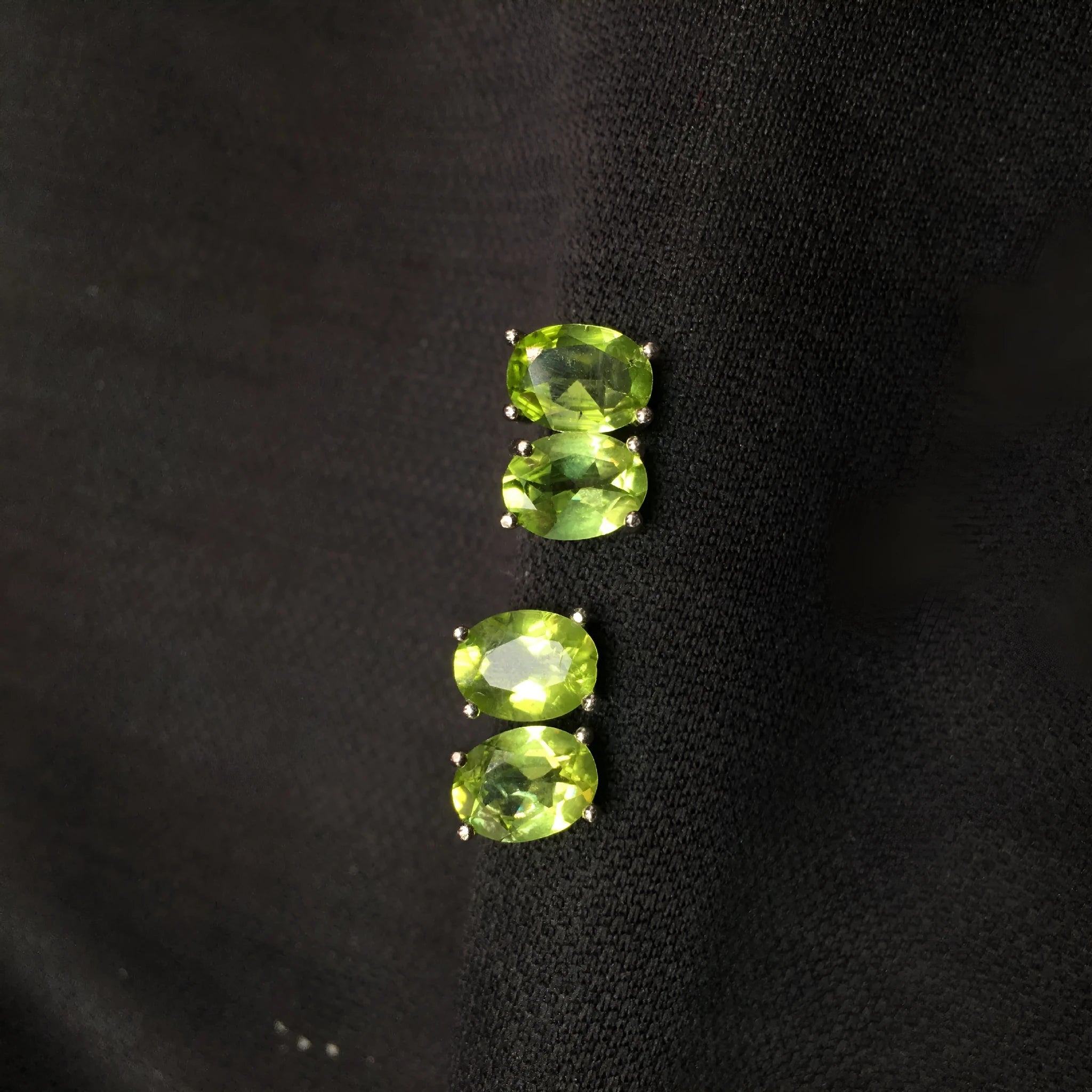 Pair of natural grass green olivine stud earrings with elliptical 6 × 8mm stones in S925 sterling silver settings
