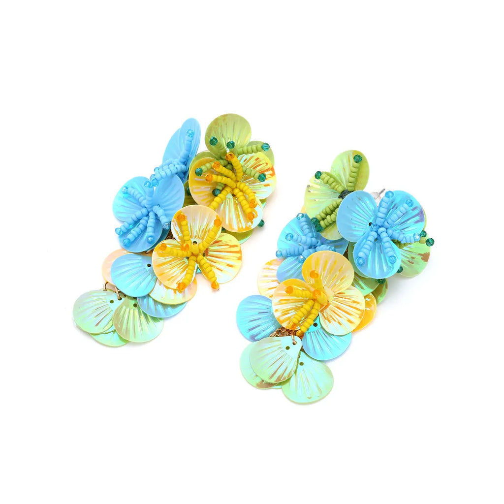 Handmade colourful bead flower and leaf drop earrings in an exaggerated oversized design.