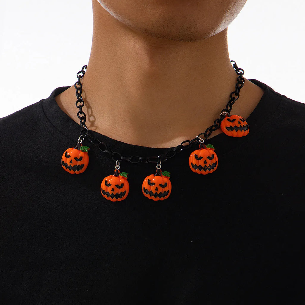 Mixed colour cartoon ghost and pumpkin acrylic pendant on a chain for Halloween.
