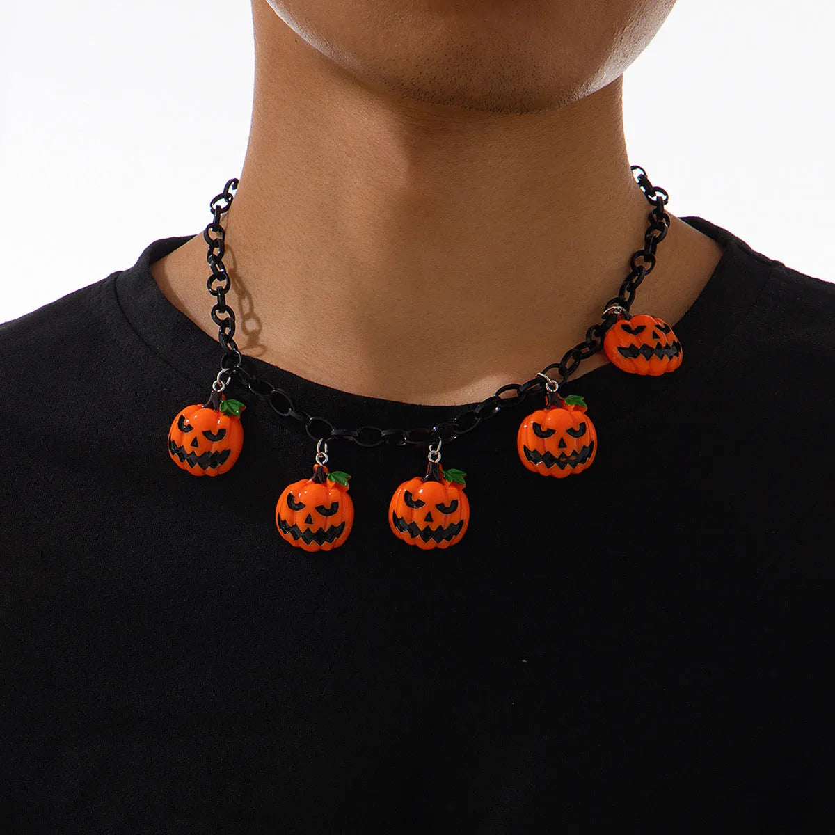 Mixed colour cartoon ghost and pumpkin acrylic pendant on a chain for Halloween.