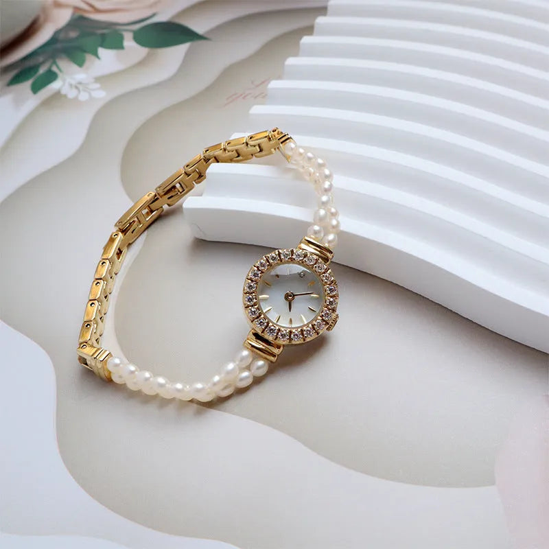 Light gold women's freshwater pearl bracelet watch with stainless steel strap and round mineral glass dial
