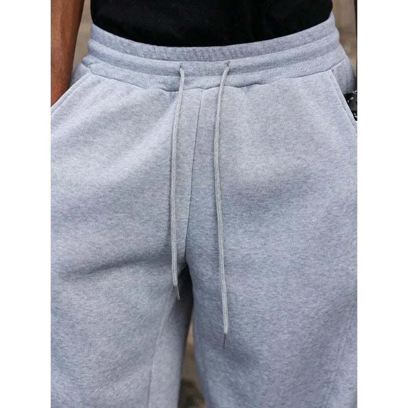 Men's high waist straight-leg casual trousers in a cropped length, shown in a neutral colour.