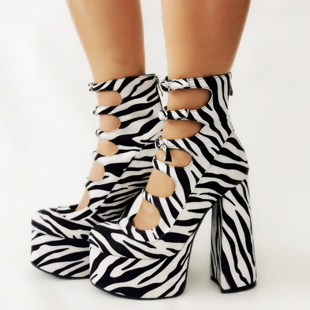 Women's black waterproof platform high heels with a serpentine belt buckle closure and round toe.