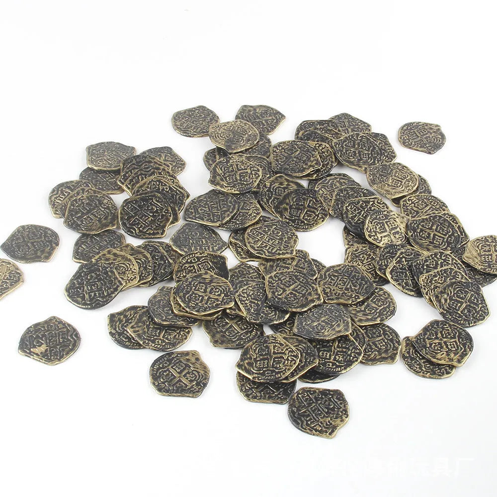 100 replica Roman pirate coins in gold, silver, and bronze finishes displayed together
