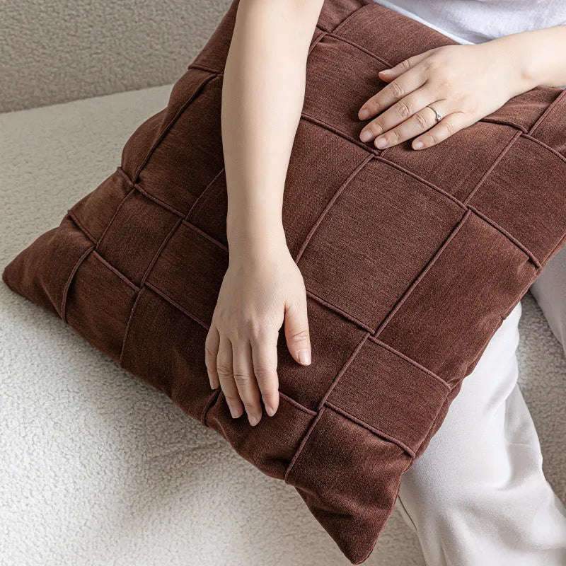 Square 50x50cm chenille woven cushion in a choice of colours like retro green or beige, shown on a sofa.