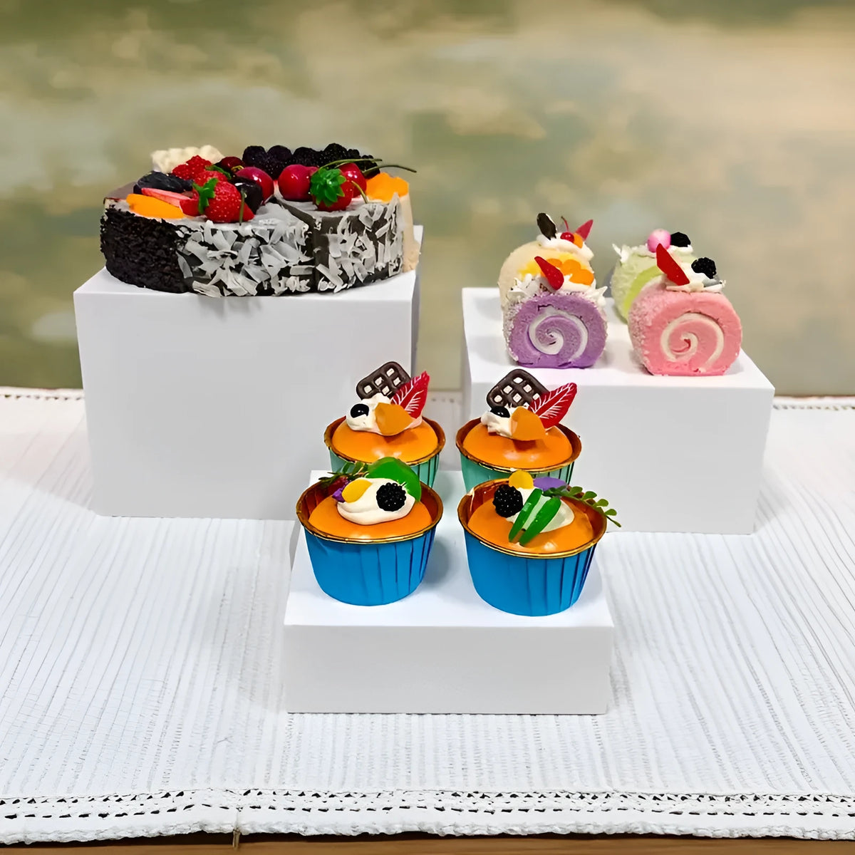 White plastic 6-piece interlocking cube dessert display stand showing tiered arrangement.
