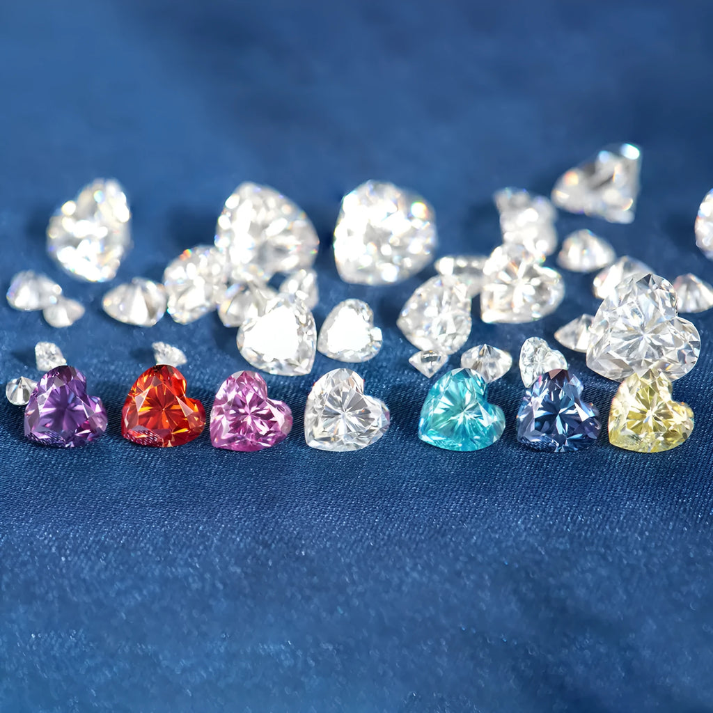 A colourful heart-shaped moissanite gemstone in various sizes and shades including lemon yellow, pink and sapphire blue.