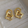 Geometric retro-style copper drop earrings with 3.4 cm length in gold or silver finish.