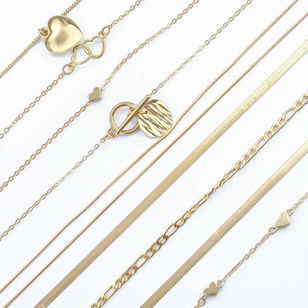 Gold electroplated women's necklace set with 10 jewellery ornaments on snake bone chain