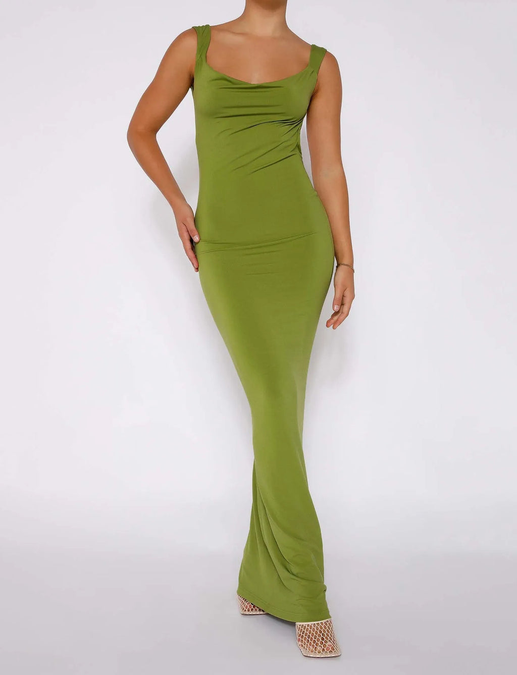 Backless milk silk sling dress in champagne colour with spaghetti straps and high waist