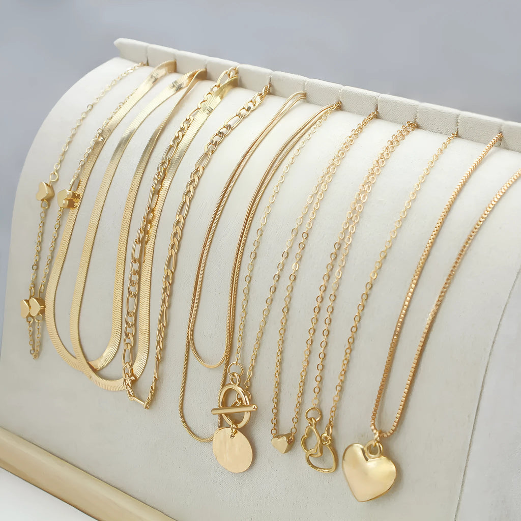 Gold electroplated women's necklace set with 10 jewellery ornaments on snake bone chain