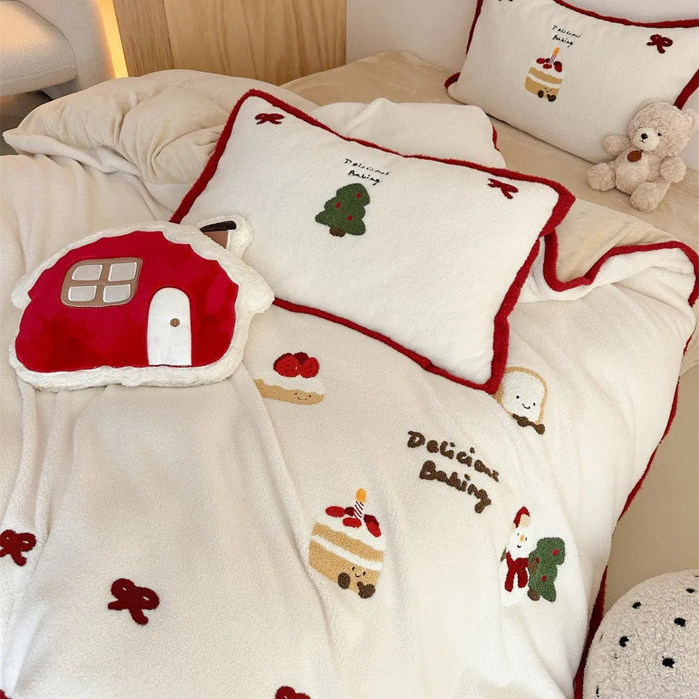 Winter Christmas cartoon patterned bedding four-piece set showing duvet cover, sheet, and pillowcases in pastel colours.