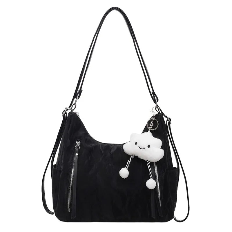 Women's soft PU leather fashion backpack in black, shown with detachable pendant.