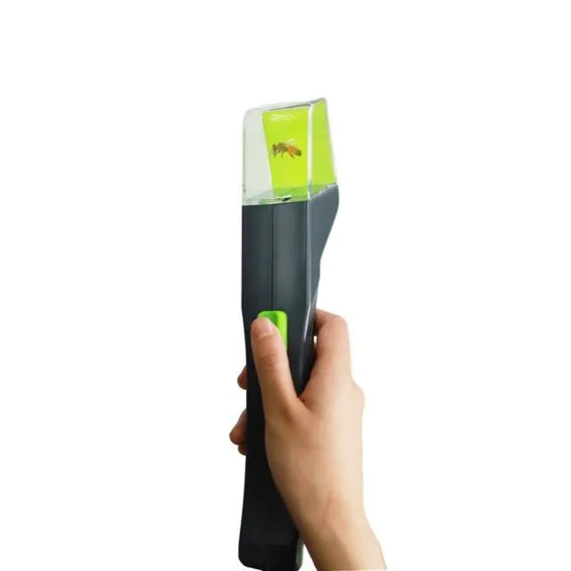 Green plastic handheld insect catcher for garden pest control
