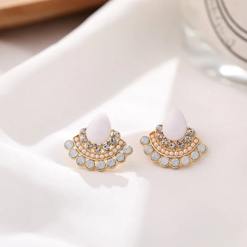 Retro silver fan-shaped earrings with needle opal and rhinestone geometric design