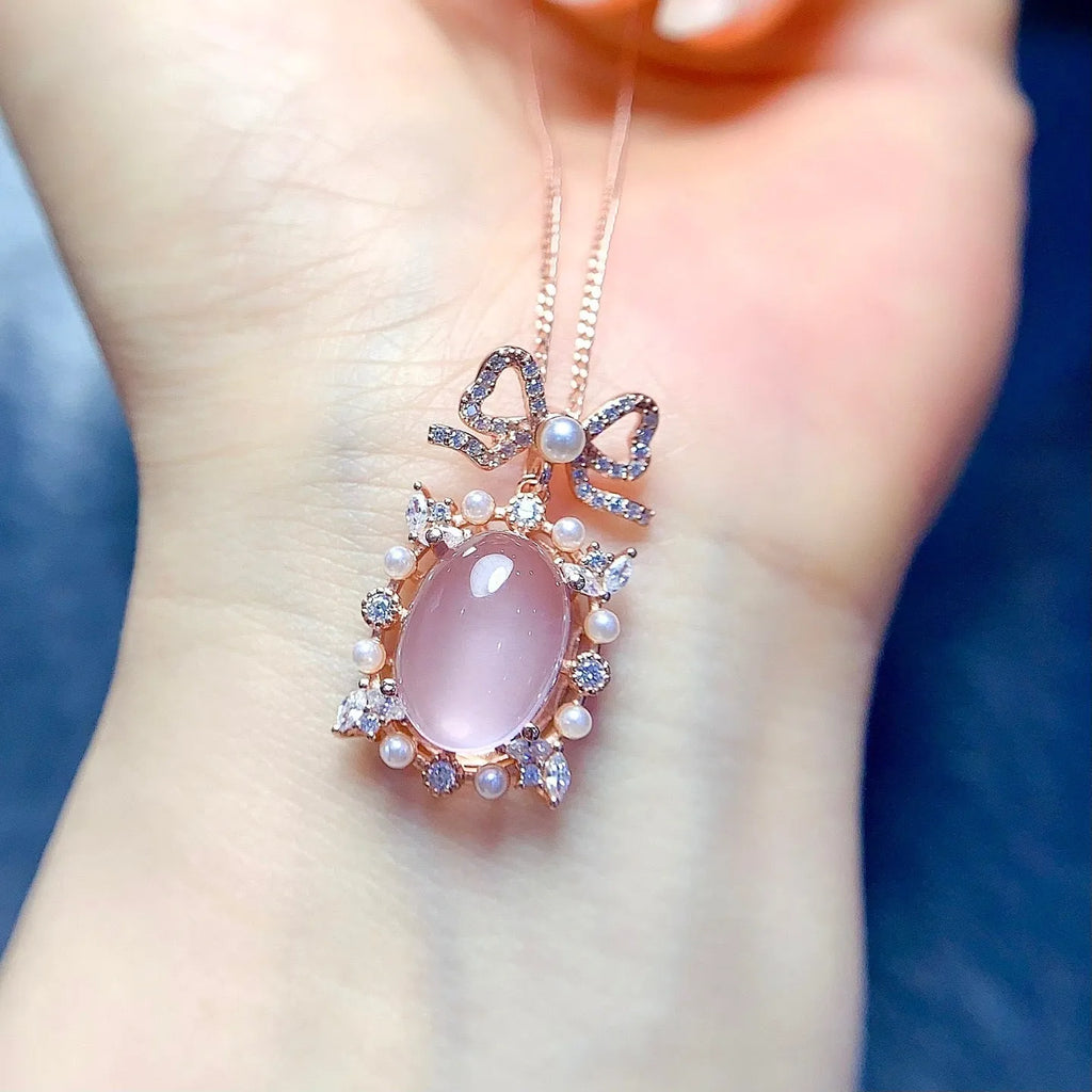 Geometric silver pendant with pink rose quartz crystal and rose gold plating on alloy chain