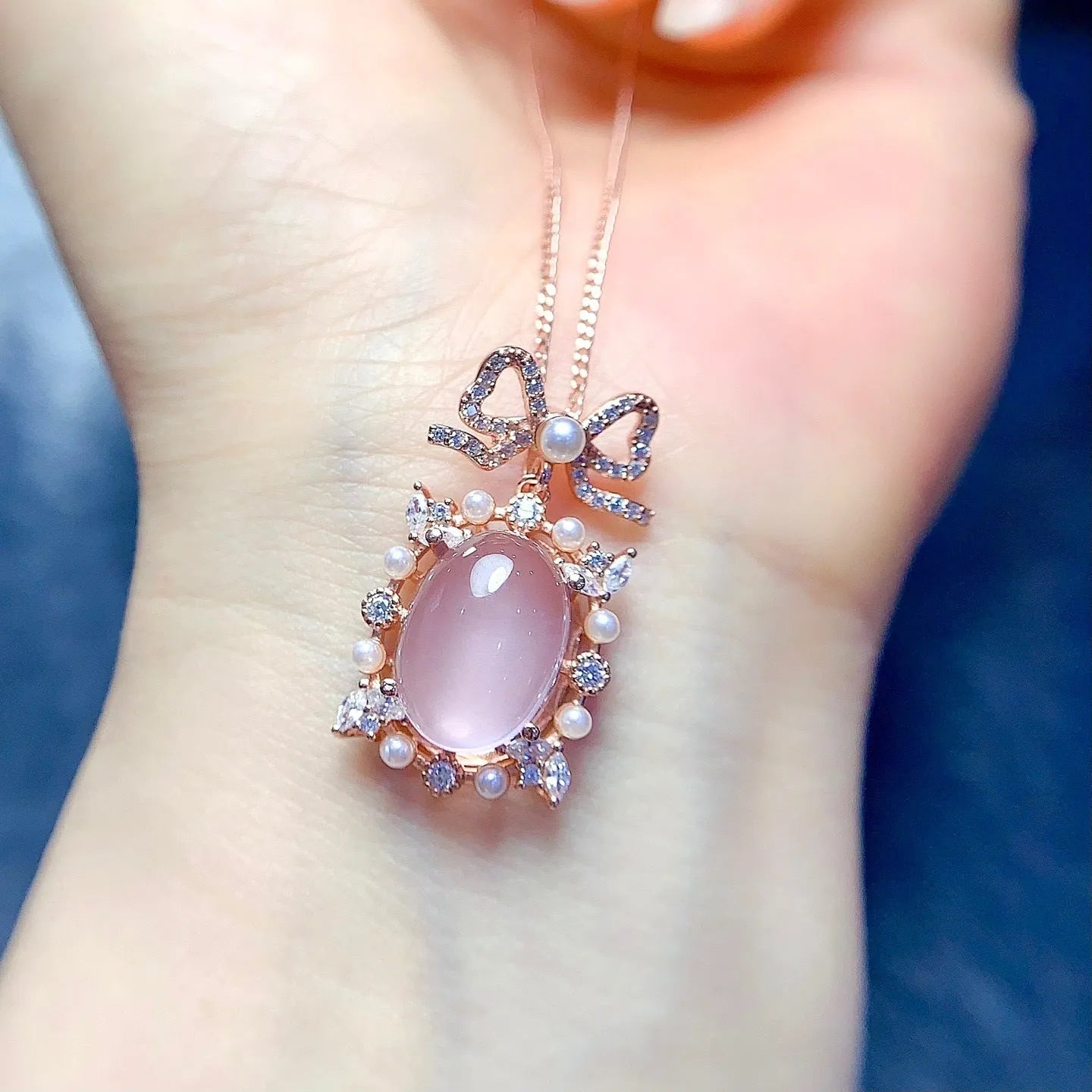 Geometric silver pendant with pink rose quartz crystal and rose gold plating on alloy chain